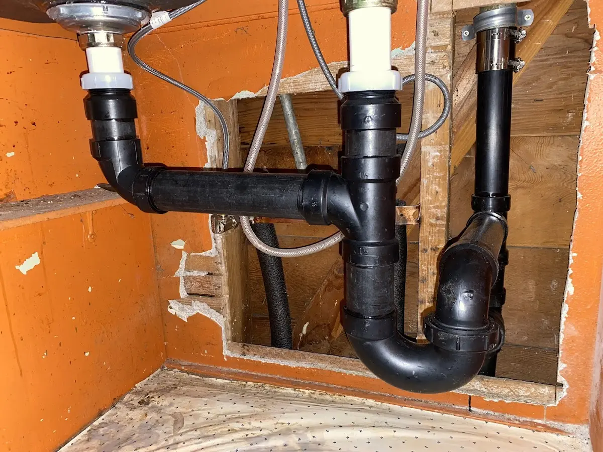 Professional Garbage Disposal Repair equipment and tools on the job in Eveleth